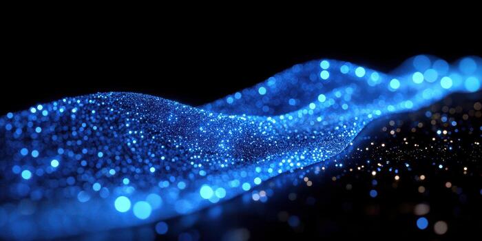 Glowing blue particles create a shimmering river effect in a dark environment photo