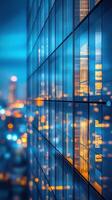 City skyline reflecting in glass building windows during twilight creates a vibrant urban atmosphere photo