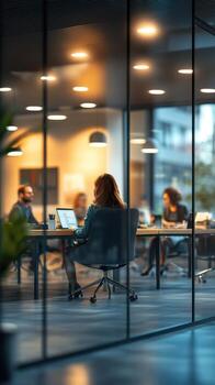 Collaborative meeting in a modern office with a diverse team discussing project ideas during late afternoon photo