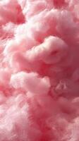 Cotton candy creates a fluffy pink cloud at a summer fair, bringing enjoyment to children and adults alike photo