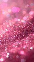 Sparkling pink glitter creates a mesmerizing abstract pattern in soft focus photo