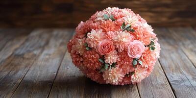 Floral arrangement featuring pink roses and chrysanthemums on wooden surface in natural light photo