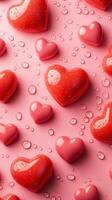 Colorful hearts scattered on a pink background with water droplets in a vibrant and cheerful display for celebrations photo