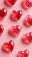 Decorative red heart shapes arranged on a soft pink background, perfect for romantic themes and celebrations photo