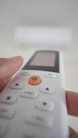 Adjusting temperature of air conditioning unit with remote control video