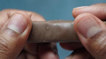 top view of hand cracking a chocolate video