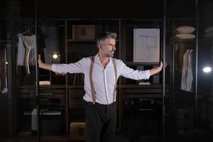 Man standing at entrance of wardrobe photo