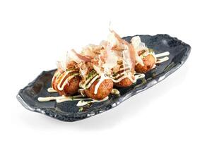 Served Takoyaki balls with sauce photo