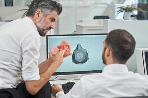 Engineers working on design of face mask photo