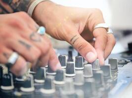 Crop DJ playing music with controller photo