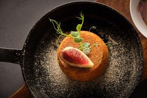 Appetizing cake served on frying pan photo