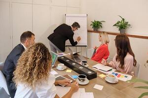 Group of colleagues working in modern workspace photo