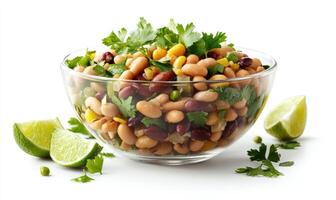 A bowl of beans and corn with a lime on the side photo