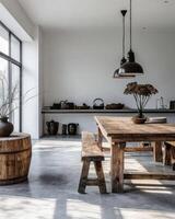 A wooden table with a bench and a vase of flowers on it photo