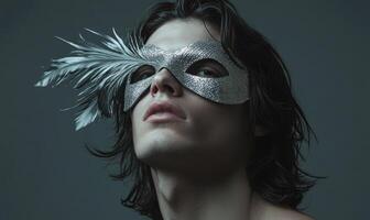 a man with a silver mask on his face photo