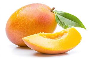 Fresh mango fruit with slice and leaf showing its vibrant color and water drops photo