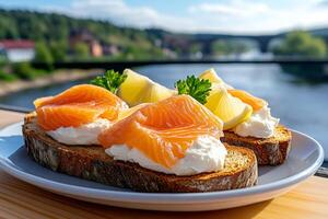 Smoked salmon and cream cheese bruschetta with lemon and parsley near Vltava River photo