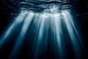 Underwater Serenity Sunlight Beams Create Ethereal Ocean Scene for Tranquil Ambiance photo