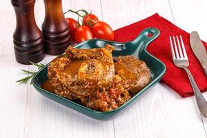A plate of food with a fork and knife photo