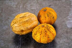 Three different types of squash on a table photo
