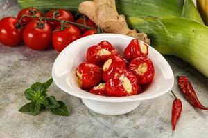 A bowl of tomatoes, corn and ginger photo