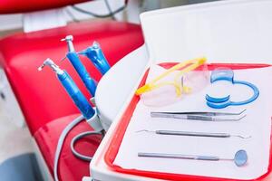 selective focus to dental instruments for oral revision. hygiene concept. photo