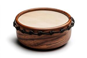 Bodhran drum resting on white background showing wooden frame and tightly laced skin photo