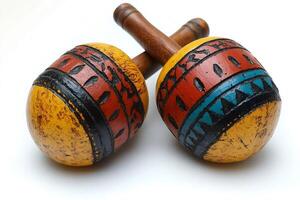 Colorful maracas resting on white background, ready to make music photo