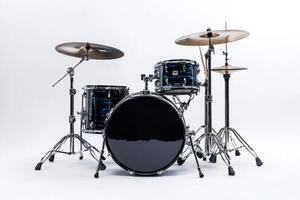Blue drum set standing on white background in studio photo