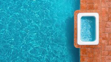 Relaxing Poolside View Aqua Blue Swimming Pool with Built in Spa photo