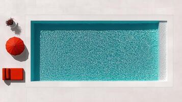 Aerial View of a Stunning Teal Swimming Pool with Red Umbrella and Lounge Chair Perfect for Summer Vacation Relaxation photo