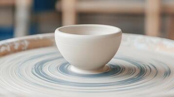 Pottery Wheel Creating a Small Ceramic Bowl Artisanal Handmade Craft Studio photo