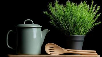 Stylish Green Teapot with Wooden Spoons and Fresh Herb Plant on Wooden Board photo