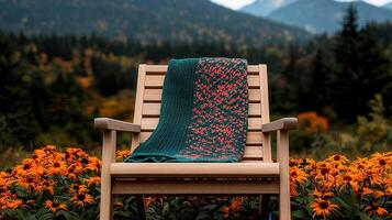 Cozy Knitted Throw Blanket on Wooden Chair in Autumnal Mountain Landscape Perfect for Relaxation and Fall Vibes photo
