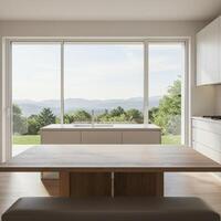 A kitchen with a table and a window overlooking the mountains photo