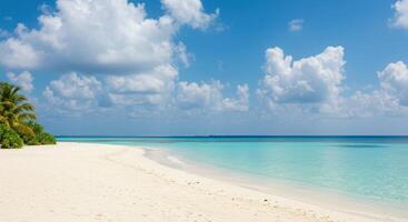 A sandy beach with white sand and blue water photo