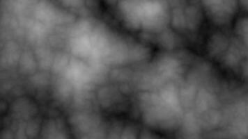A mysterious and atmospheric image featuring dark, cloudy smoke swirling across a black background, creating a moody and dramatic effect. video