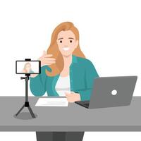 Woman is recording a using a smartphone mounted on a tripod with a laptop and notes. vector