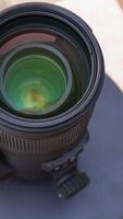 DSLR telephoto zoom lens closeup on a turntable with high angle view video