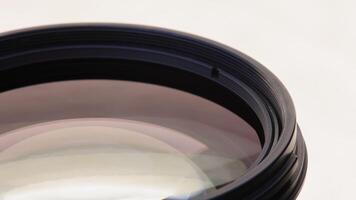 DSLR telephoto zoom lens closeup on a turntable with high angle view video