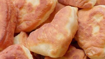 Homemade Fried Pies Spinning on Turntable Closeup Loopable video