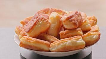 Homemade Fried Pies Spinning on Turntable Closeup Loopable video