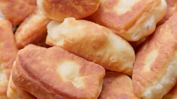 Homemade Fried Pies Spinning on Turntable Closeup Loopable video