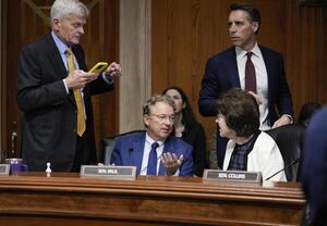Senator Josh Hawley (R-MO), right, listens to Senator Bill Cassidy, (R-LA), left, while Senator Rand Paul (R-KY) speaks with Senator Susan Collins (R-ME) during a business meeting of the Senate Committee on Health, Education, Labor, and Pensions in Washington, DC, March 13, 2025. editorial_image