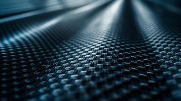 Close-up of sleek black carbon fiber surface showcasing intricate patterns and textures. photo