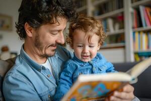A joyful father reading to his curly-haired young son, both smiling and enjoying storytime together. photo