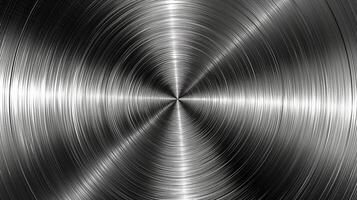 Close-up of polished stainless steel surface showcasing a circular brushed texture. photo