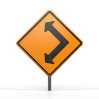 A cautionary road sign indicating a sharp turn ahead, presented in a striking orange and black design. photo