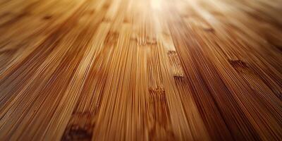 Close-up view of a smooth, polished bamboo surface with rich warm tones. photo