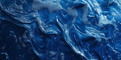 A captivating abstract ocean-like pattern of deep blue with swirling bubbles and foam. photo